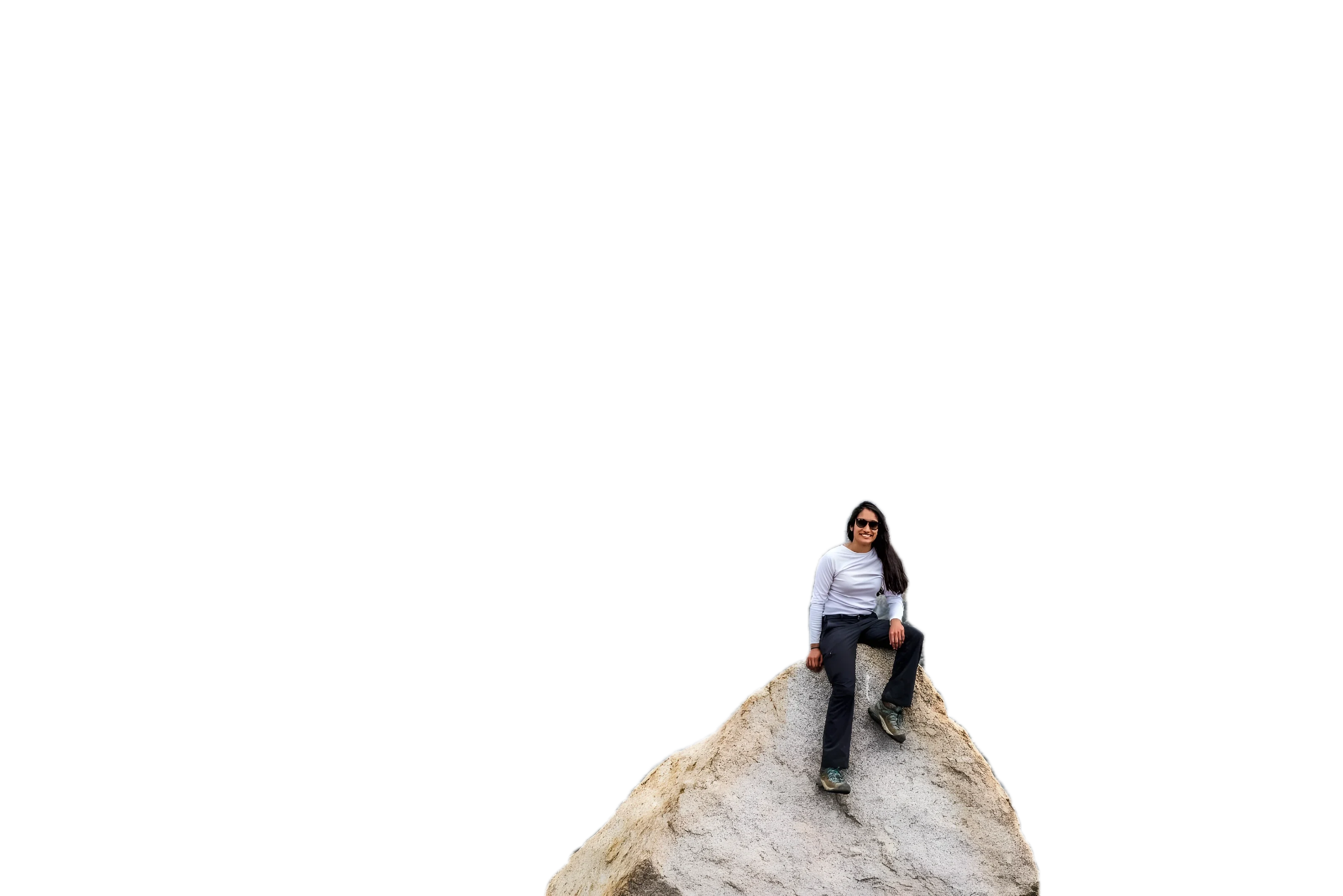 Lisa Dlima seated on a rock